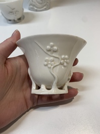 Two Chinese Dehua blanc de Chine wine cups and a figure of Liuhai, 18/19th C.