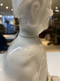 Two Chinese Dehua blanc de Chine wine cups and a figure of Liuhai, 18/19th C.