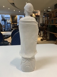 Two Chinese Dehua blanc de Chine wine cups and a figure of Liuhai, 18/19th C.