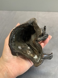 A Japanese gold-splashed bronze incense burner in the shape of an immortal riding a buffalo, ​​Kin San Sō On 金産宗音製造 mark, Meiji, 19th C.