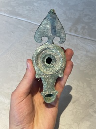 A bronze urn, a bronze canteen with relief design and a pair of bronze oil lamps, Etruscan and Roman civilizations, 9th C. B.C/5th C.