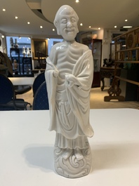 Two Chinese Dehua blanc de Chine wine cups and a figure of Liuhai, 18/19th C.