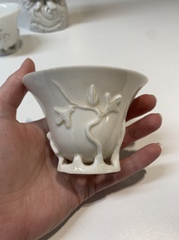 Two Chinese Dehua blanc de Chine wine cups and a figure of Liuhai, 18/19th C.