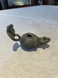 A bronze urn, a bronze canteen with relief design and a pair of bronze oil lamps, Etruscan and Roman civilizations, 9th C. B.C/5th C.