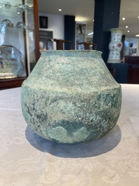 A bronze urn, a bronze canteen with relief design and a pair of bronze oil lamps, Etruscan and Roman civilizations, 9th C. B.C/5th C.