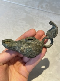 A bronze urn, a bronze canteen with relief design and a pair of bronze oil lamps, Etruscan and Roman civilizations, 9th C. B.C/5th C.