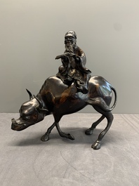 A Japanese gold-splashed bronze incense burner in the shape of an immortal riding a buffalo, ​​Kin San Sō On 金産宗音製造 mark, Meiji, 19th C.