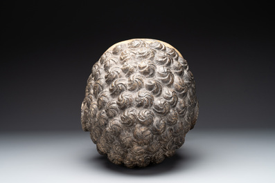 A large Chinese carved stone head of Buddha with traces of gilding and polychromy, Ming