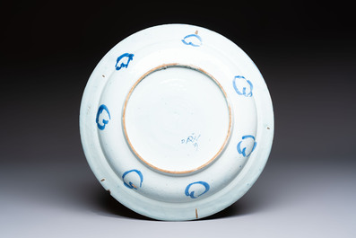 A large blue and white Dutch Delft chinoiserie dish, 17th C.