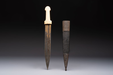 A Caucasian gilt Damascus steel 'Khinjal' with a whale bone hilt and a leather and damascened steel scabbard, 19th C.