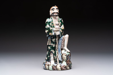 A pair of Chinese famille verte covered jars, a Tieguai Li figure, a blue and white teapot and a biscuit saucer, Kangxi and Qing Yu Tang mark, 19th C.