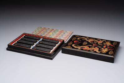 A set of eight Chinese 'Yu Zhi Min Sheng Zai Qin Shi 御製民生在勤詩' ink cakes with a gilt-lacquered 'dragon' box, Hu Kaiwen 胡開文 mark, 20th C.