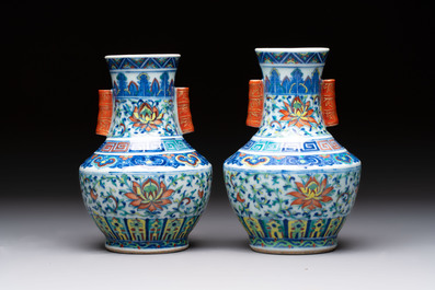 A pair of Chinese doucai 'Hu' vases with lotus scroll design, Qianlong mark, 19th C.
