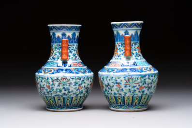 A pair of Chinese doucai 'Hu' vases with lotus scroll design, Qianlong mark, 19th C.