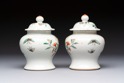 A pair of Chinese famille verte covered jars, a Tieguai Li figure, a blue and white teapot and a biscuit saucer, Kangxi and Qing Yu Tang mark, 19th C.