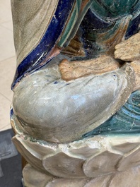 A large Chinese polychrome-glazed Shiwan stoneware figure of Guanyin, 19th C.