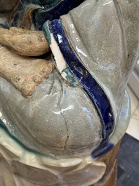 A large Chinese polychrome-glazed Shiwan stoneware figure of Guanyin, 19th C.