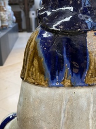 A large Chinese polychrome-glazed Shiwan stoneware figure of Guanyin, 19th C.