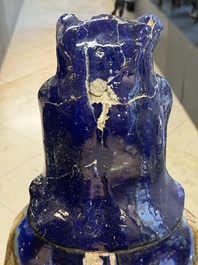 A large Chinese polychrome-glazed Shiwan stoneware figure of Guanyin, 19th C.