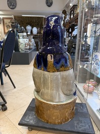 A large Chinese polychrome-glazed Shiwan stoneware figure of Guanyin, 19th C.