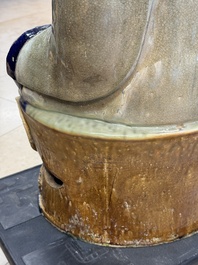 A large Chinese polychrome-glazed Shiwan stoneware figure of Guanyin, 19th C.