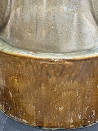 A large Chinese polychrome-glazed Shiwan stoneware figure of Guanyin, 19th C.