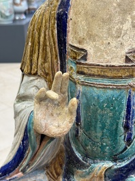 A large Chinese polychrome-glazed Shiwan stoneware figure of Guanyin, 19th C.