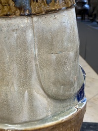 A large Chinese polychrome-glazed Shiwan stoneware figure of Guanyin, 19th C.