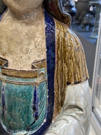 A large Chinese polychrome-glazed Shiwan stoneware figure of Guanyin, 19th C.
