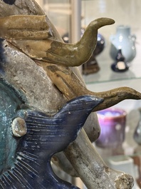 A large Chinese polychrome-glazed Shiwan stoneware dragon, 19th C.