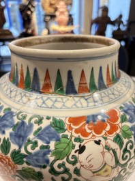 A Chinese wucai 'He He Er Xian' vase on gilt-bronze stand, 19th C.