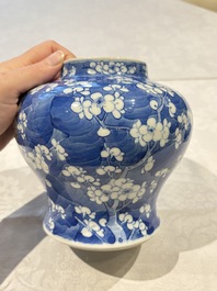 Two pairs of Chinese blue and white covered vases and a large covered vase, 19th C.