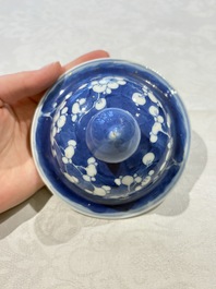 Two pairs of Chinese blue and white covered vases and a large covered vase, 19th C.