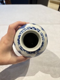Two pairs of Chinese blue and white covered vases and a large covered vase, 19th C.