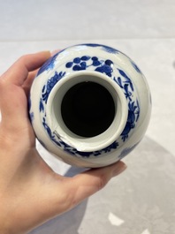 Two pairs of Chinese blue and white covered vases and a large covered vase, 19th C.