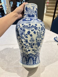Two pairs of Chinese blue and white covered vases and a large covered vase, 19th C.