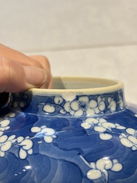 Two pairs of Chinese blue and white covered vases and a large covered vase, 19th C.