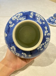 Two pairs of Chinese blue and white covered vases and a large covered vase, 19th C.