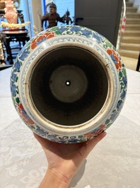 A Chinese wucai 'He He Er Xian' vase on gilt-bronze stand, 19th C.