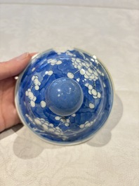 Two pairs of Chinese blue and white covered vases and a large covered vase, 19th C.