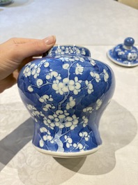 Two pairs of Chinese blue and white covered vases and a large covered vase, 19th C.