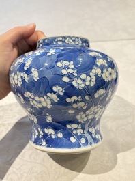 Two pairs of Chinese blue and white covered vases and a large covered vase, 19th C.