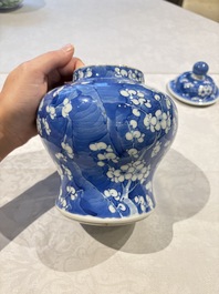 Two pairs of Chinese blue and white covered vases and a large covered vase, 19th C.