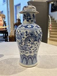 Two pairs of Chinese blue and white covered vases and a large covered vase, 19th C.
