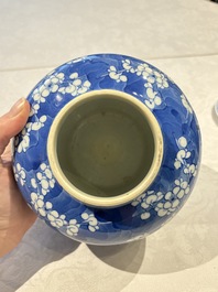 Two pairs of Chinese blue and white covered vases and a large covered vase, 19th C.