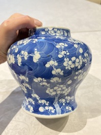 Two pairs of Chinese blue and white covered vases and a large covered vase, 19th C.