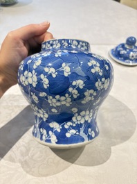 Two pairs of Chinese blue and white covered vases and a large covered vase, 19th C.