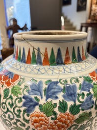 A Chinese wucai 'He He Er Xian' vase on gilt-bronze stand, 19th C.