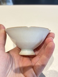 A pair of Chinese qingbai vases and a cup on a stand, 20th C.