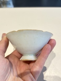 A pair of Chinese qingbai vases and a cup on a stand, 20th C.